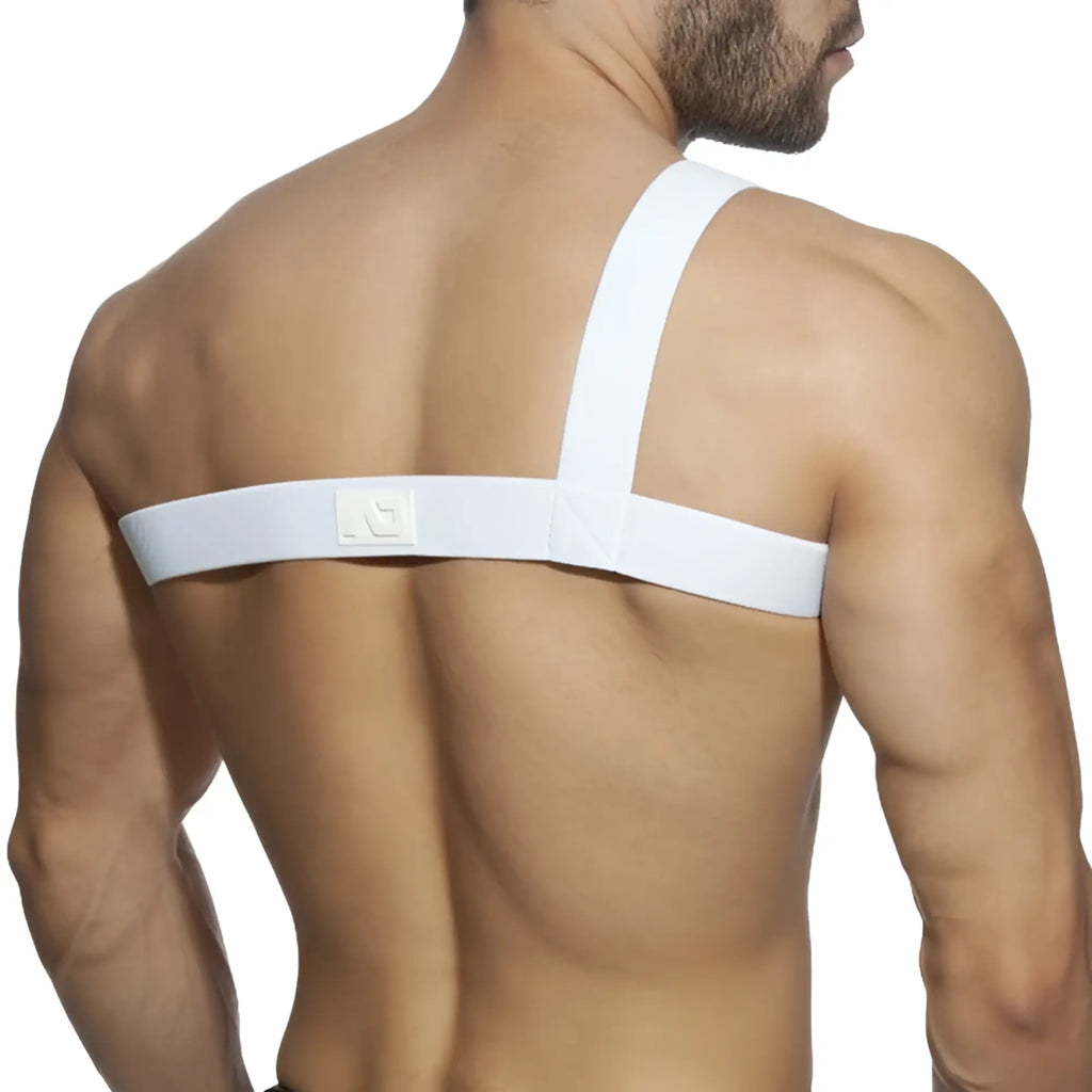 Back view of white gladiator clip harness with elastic strap featuring subtle textured weave and small logo patch