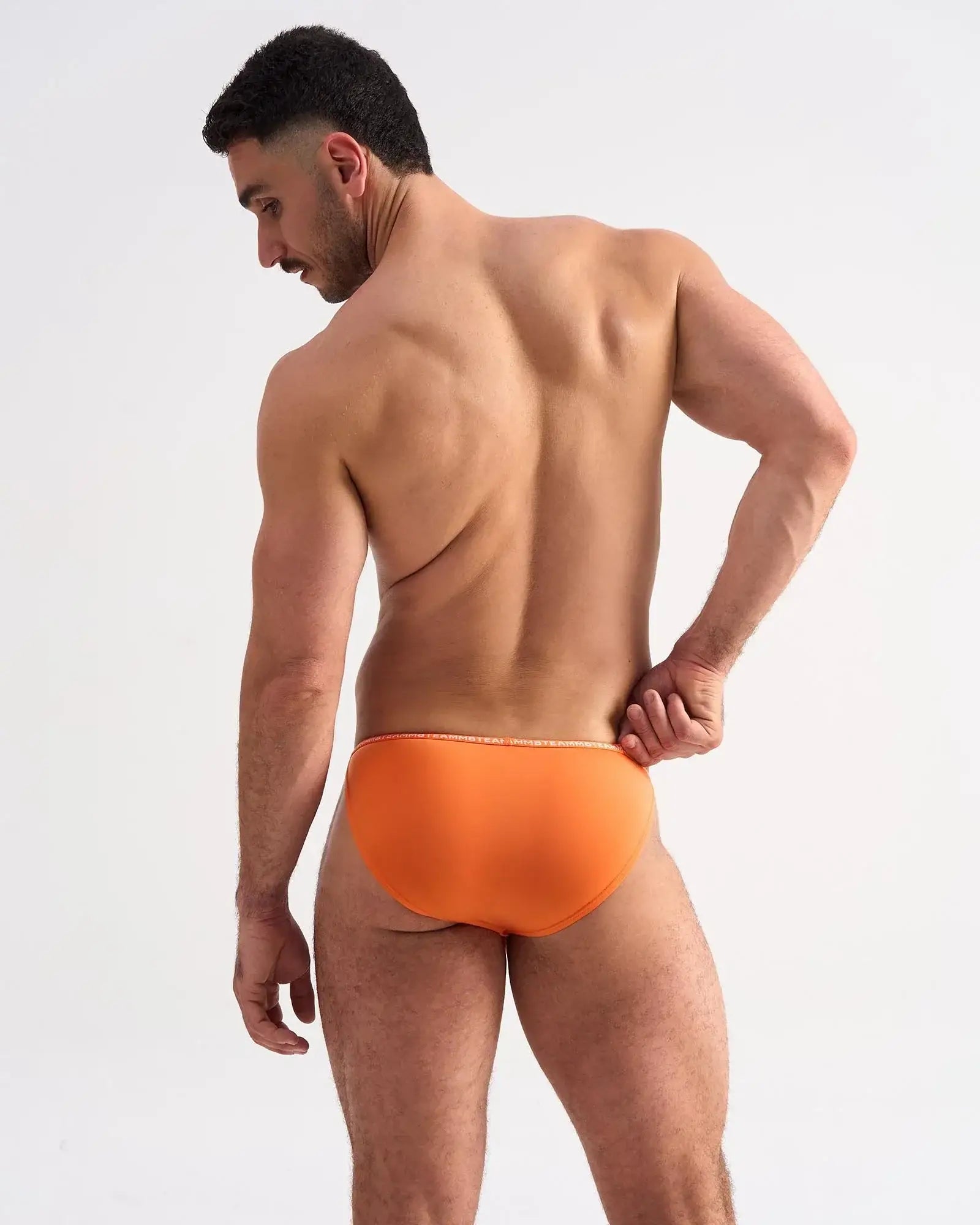 Bright orange glide micro brief with subtle white trim along the waistband made for comfortable support