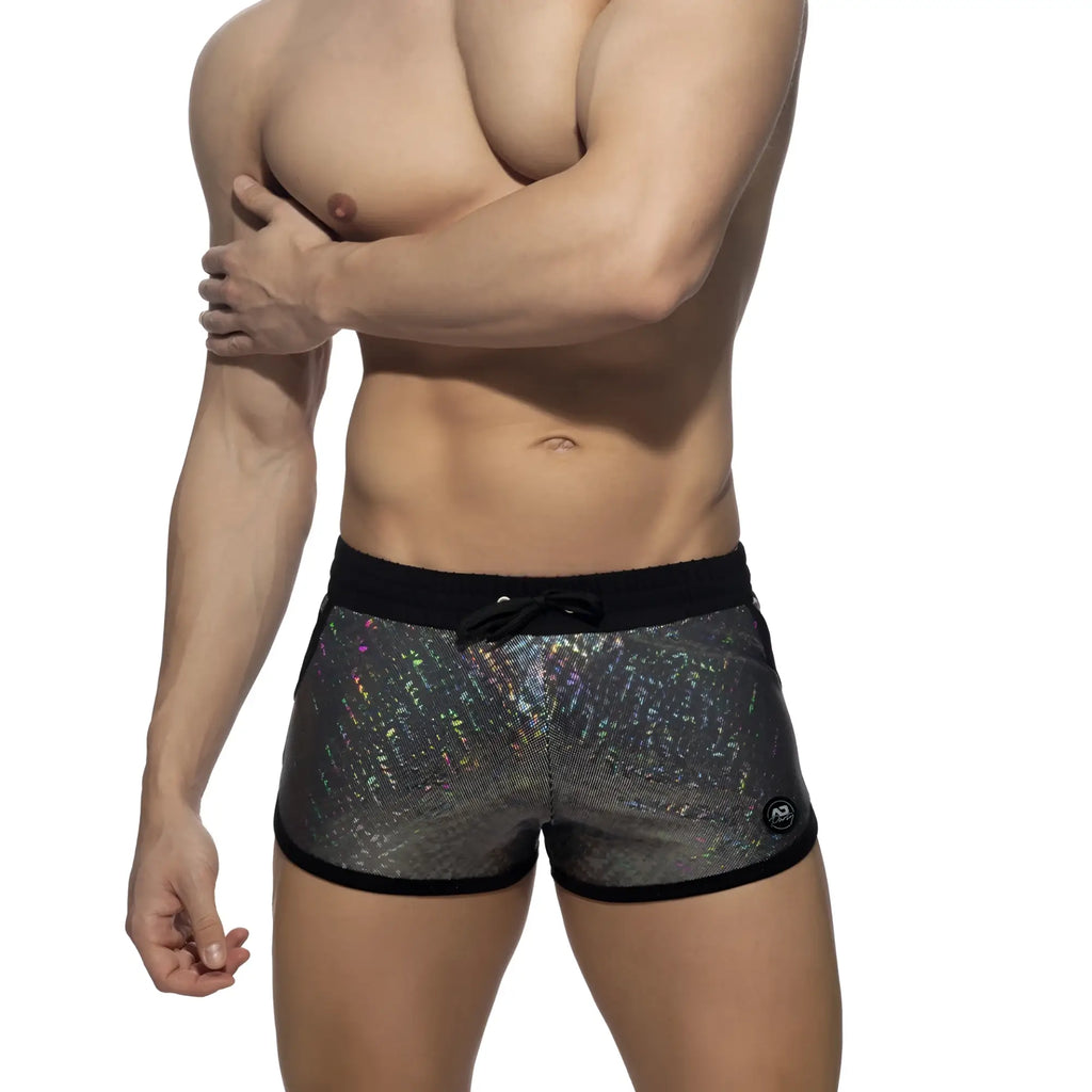 Glitter short swim trunks with black trim and shimmering iridescent silver holographic fabric for stylish beachwear