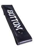 Black leather glow center strap bottom with white bottom lettering and two black snap buttons