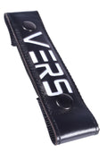 Black leather glow center strap versus with white lettering and two black circular studs