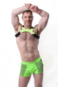 Neon green glowtime shorts with black trim made of mesh material featuring a matching harness strap