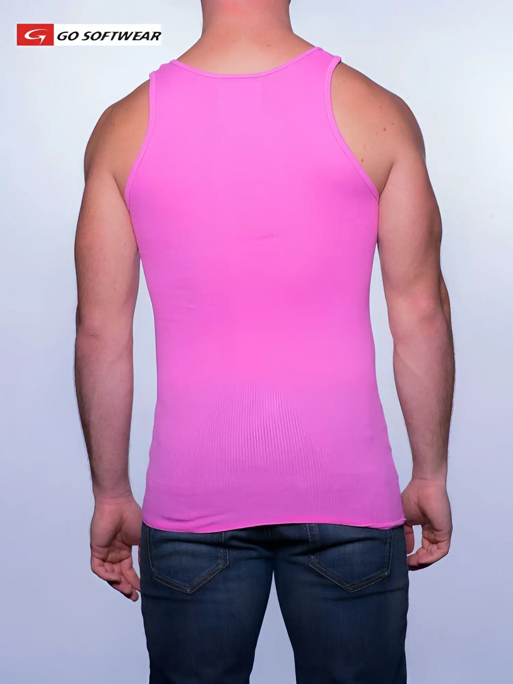 A vibrant deep pink ribbed tank top from Go Softwear made of soft material in size small