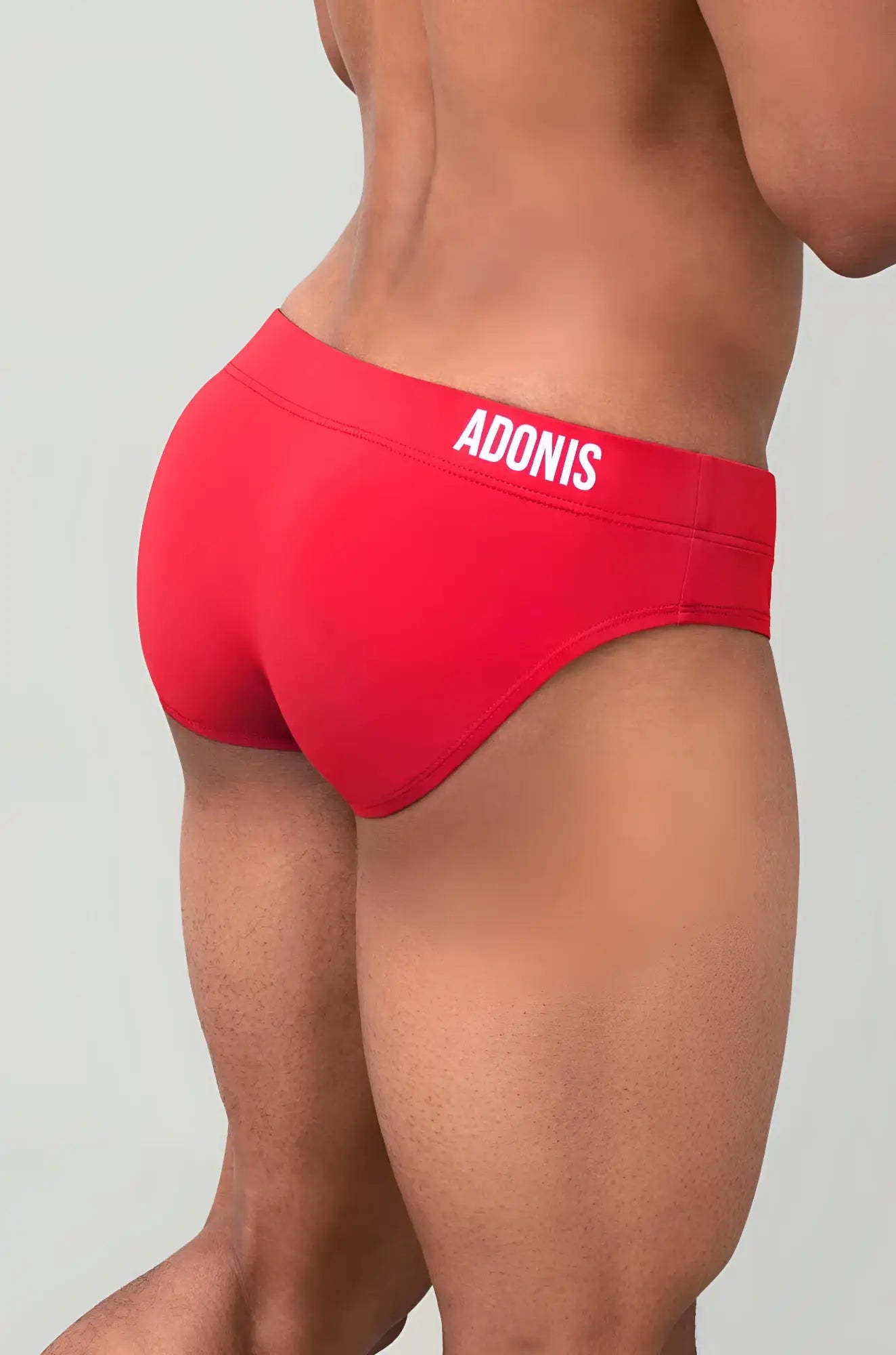 Red adonis goji berry swim brief in red with white lettering on waistband for swimwear use