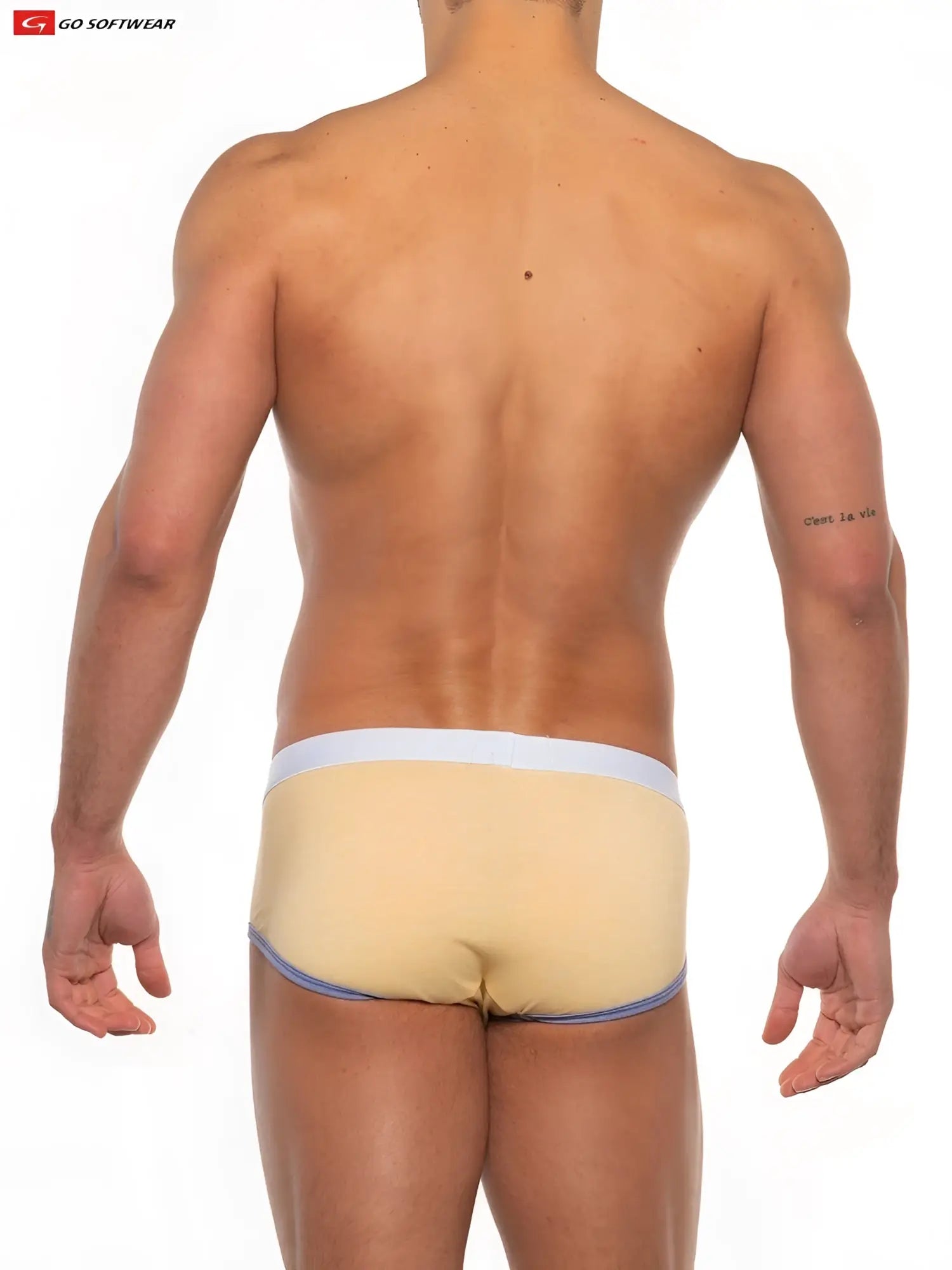 Beige men’s gold coast brief with white waistband and blue trim made from soft breathable fabric