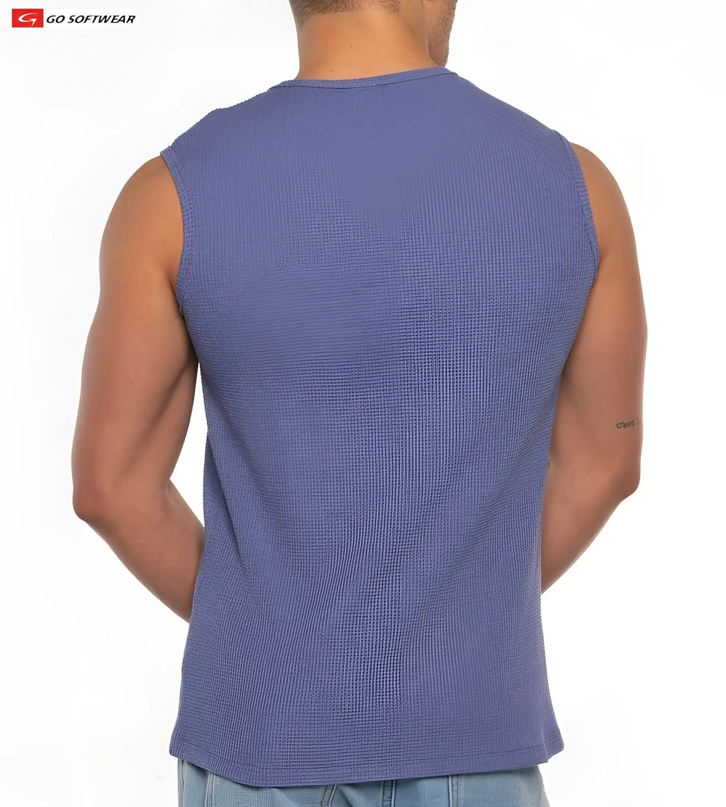 A men’s sleeveless waffle-knit gold coast tee in medium blue with a round neckline and tailored fit