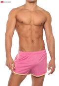 Pink gold coast sport shorts with light beige trim and elastic waistband designed for athletic use