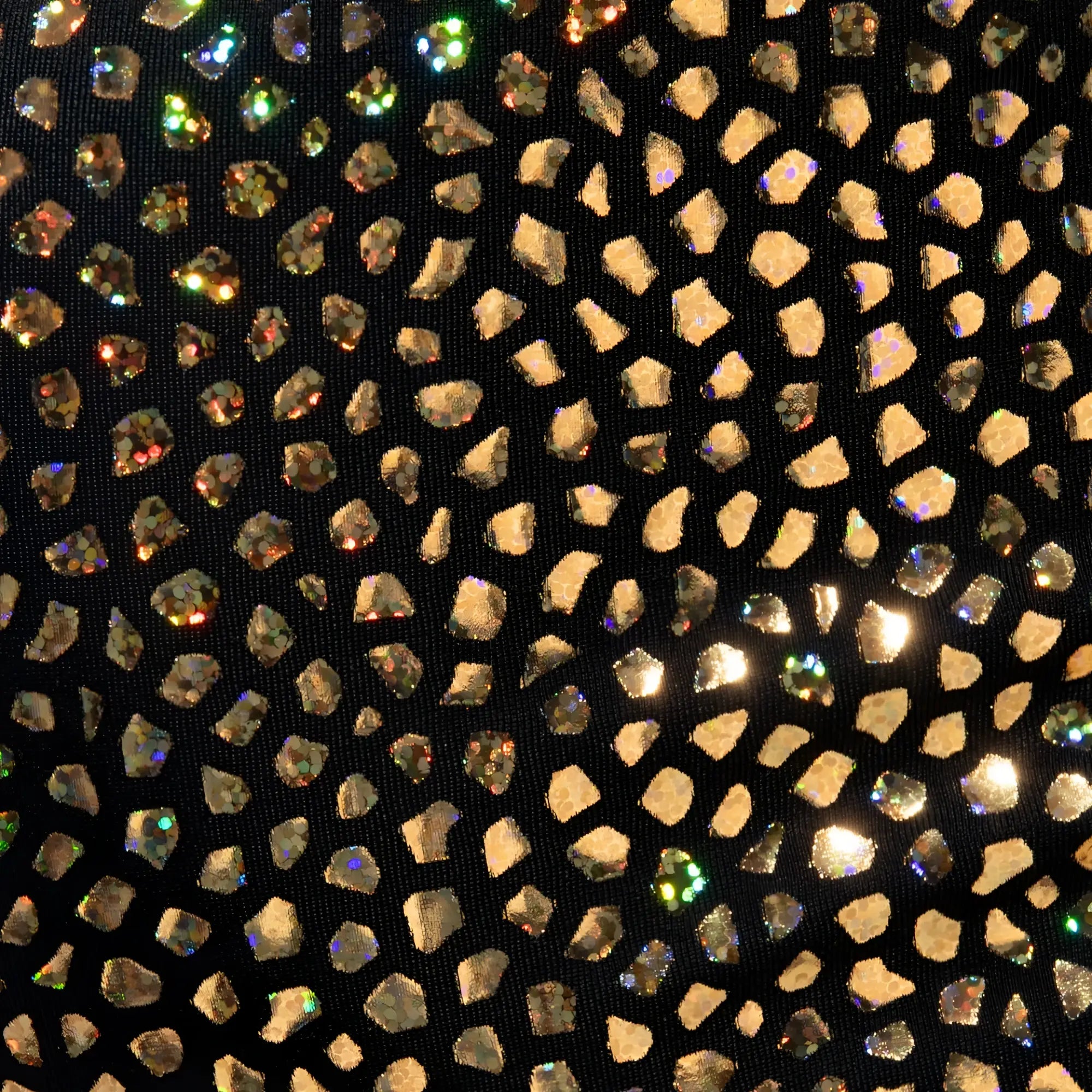 Black fabric trunk adorned with scattered gold and iridescent rhinestones in a mosaic pattern called gold stones trunk