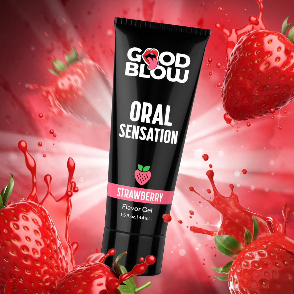Black tube of Good Blow Strawberry Oral Sensation Gel surrounded by fresh strawberries and red liquid splashes.