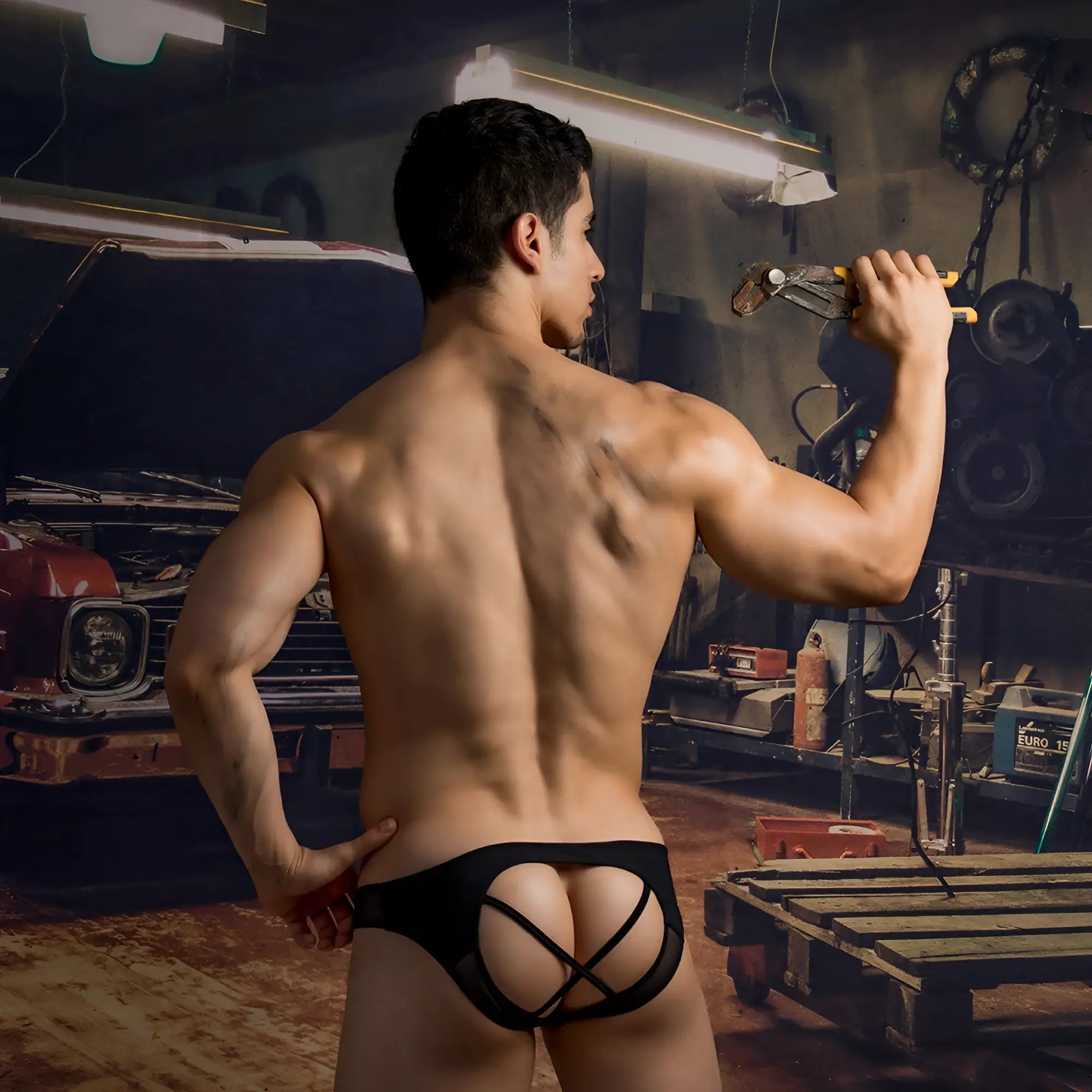 Black lace-trimmed good devil gde070 jockstrap briefs with a distinctive crisscross back design shown from the back