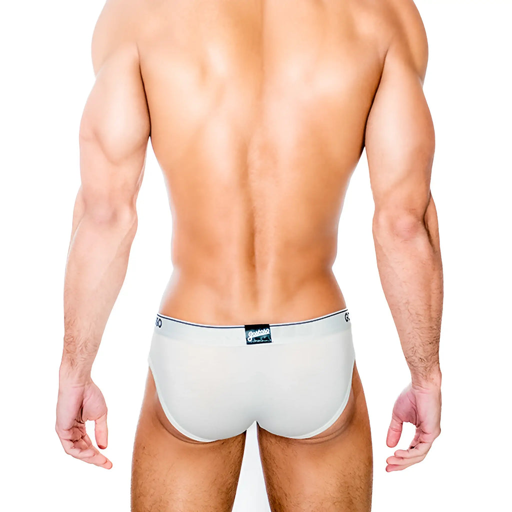A sleek solid gostoso underwear brief in light gray with a subtle black waistband and small branded label on the back