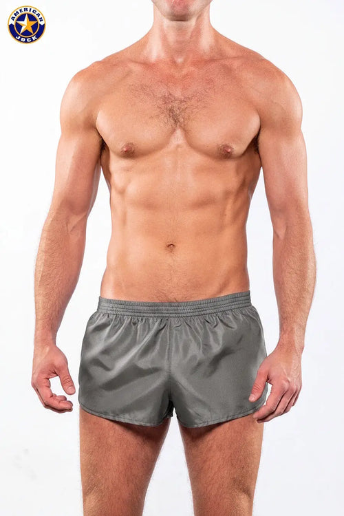 Men's pewter running shorts by AMERICAN JOCK featuring a lightweight design and elastic waistband shown on a model.
