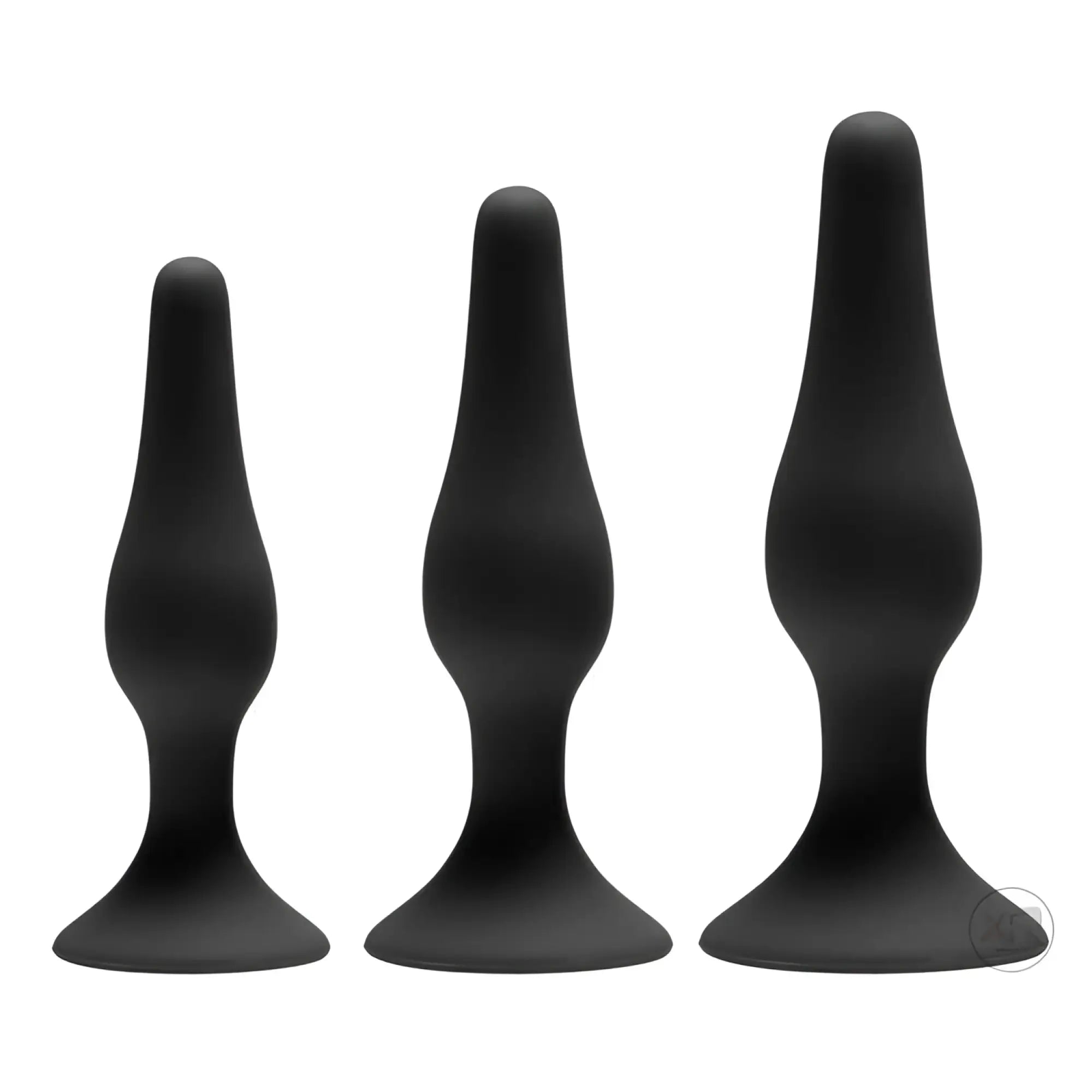GreyGasms Apprentice 3-piece silicone anal trainer set: three smooth, black, flared-base plugs of increasing sizes.