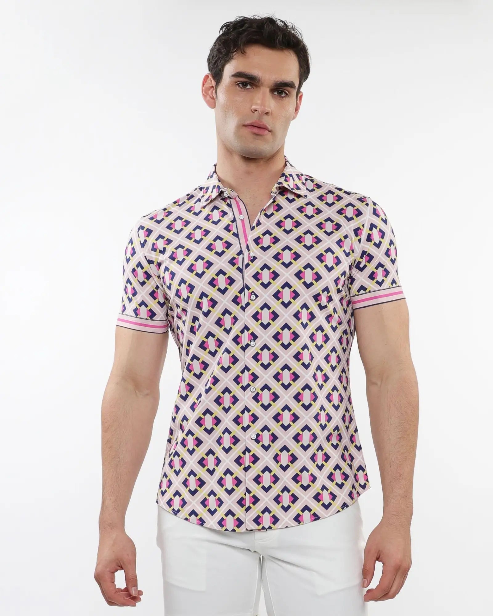 A man wearing a grid parquet printed performance short-sleeved shirt with pink purple and beige geometric patterns