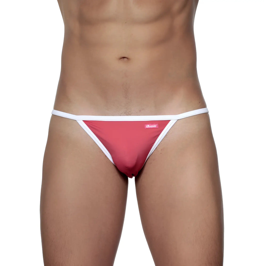 A vibrant pink groovin accent string bikini thong with white trim and a small brand tag in rouge red color