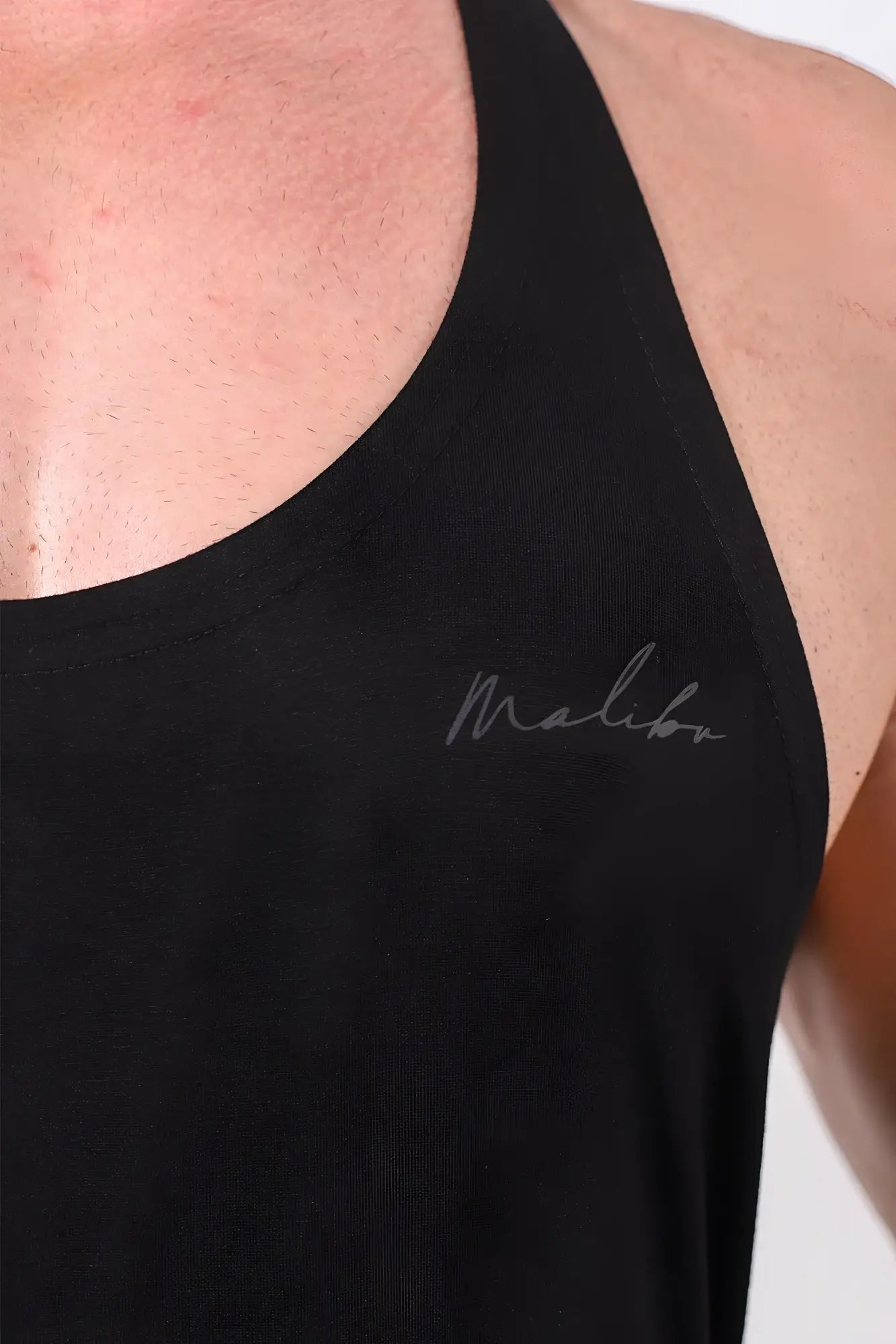 Black malibu tank top gym stringer with subtle silver script logo designed for classic workout sessions
