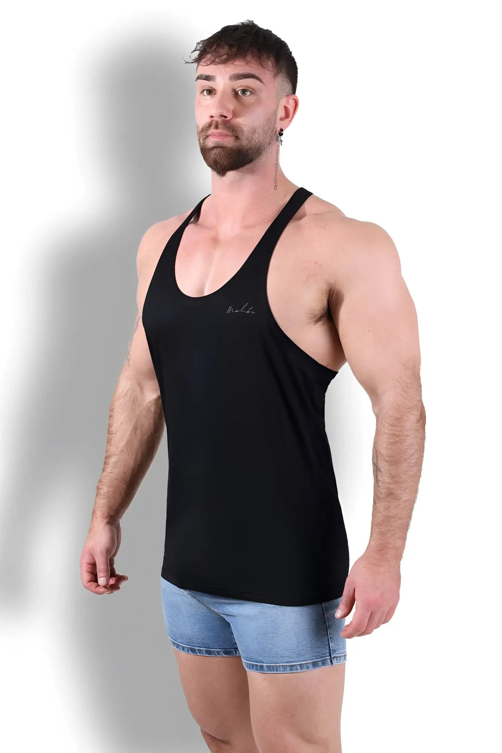 Black racerback tank top with subtle embroidered logo on chest ideal for gym and workout in breathable fabric