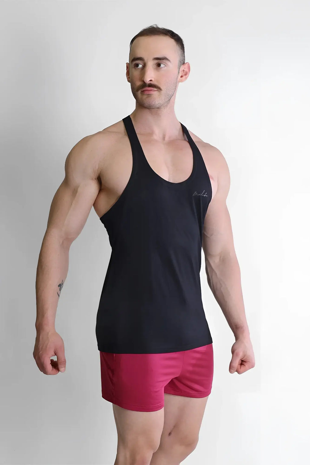 Black racerback tank top gym bae classic workout stringer with subtle embroidered logo on chest in comfortable fabric