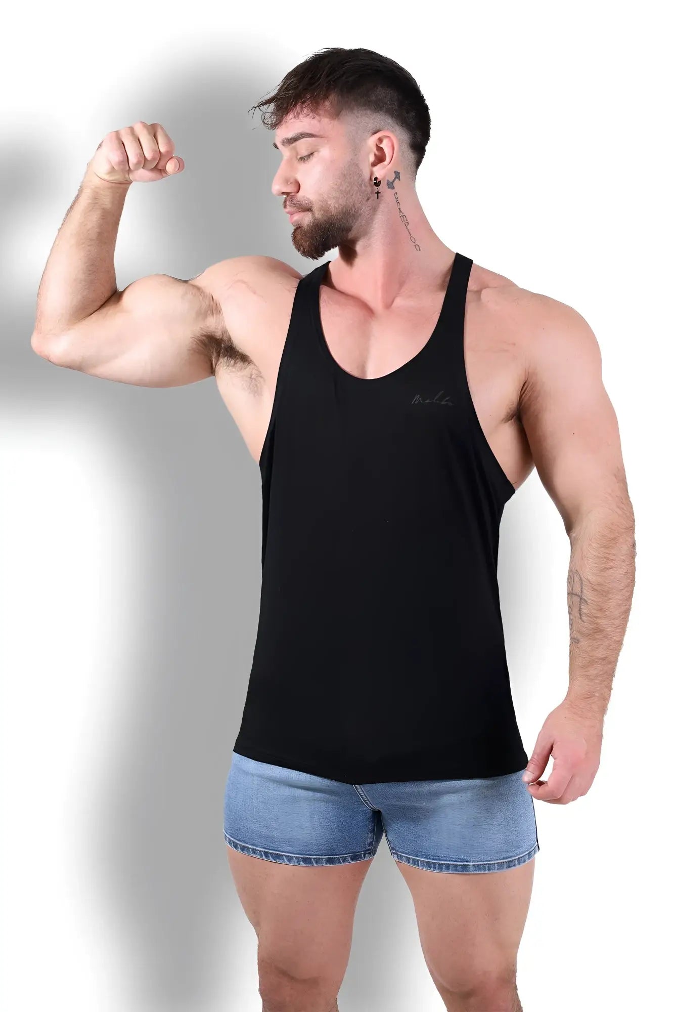 Black sleeveless gym bae classic workout stringer tank top with subtle embroidered logo on left chest for exercise