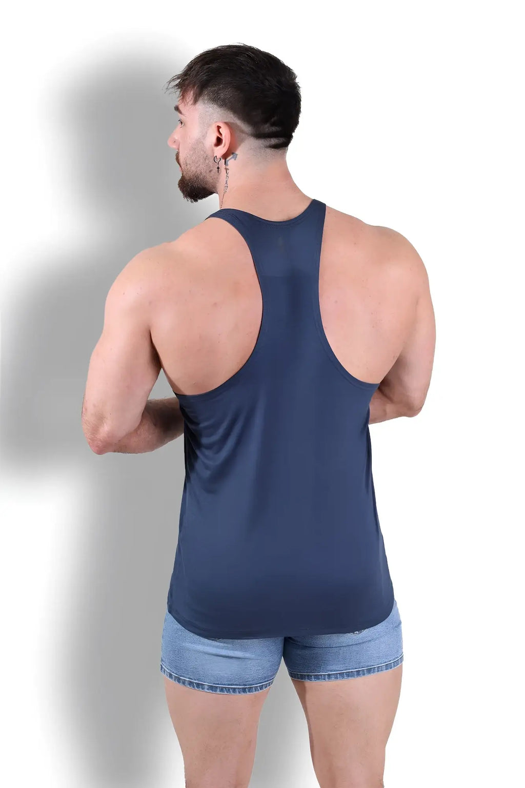 A navy blue Gym Bae classic workout stringer tank top with racerback design made of smooth stretchy fabric