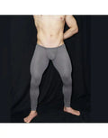 Men's grey mesh gym tights by Arroyman featuring a snug fit and bulge design shown on a model against a dark background.