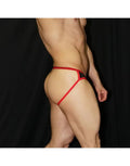 Men's jockstrap in red and black featuring eco-leather material and a minimal design shown on a model from the side by Arroyman