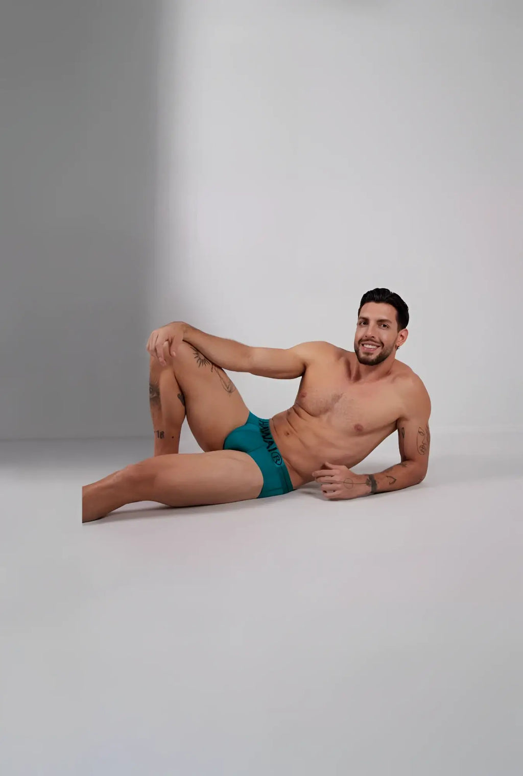 Teal green hawai 41963 microfiber men’s briefs with black logo waistband showcasing front view