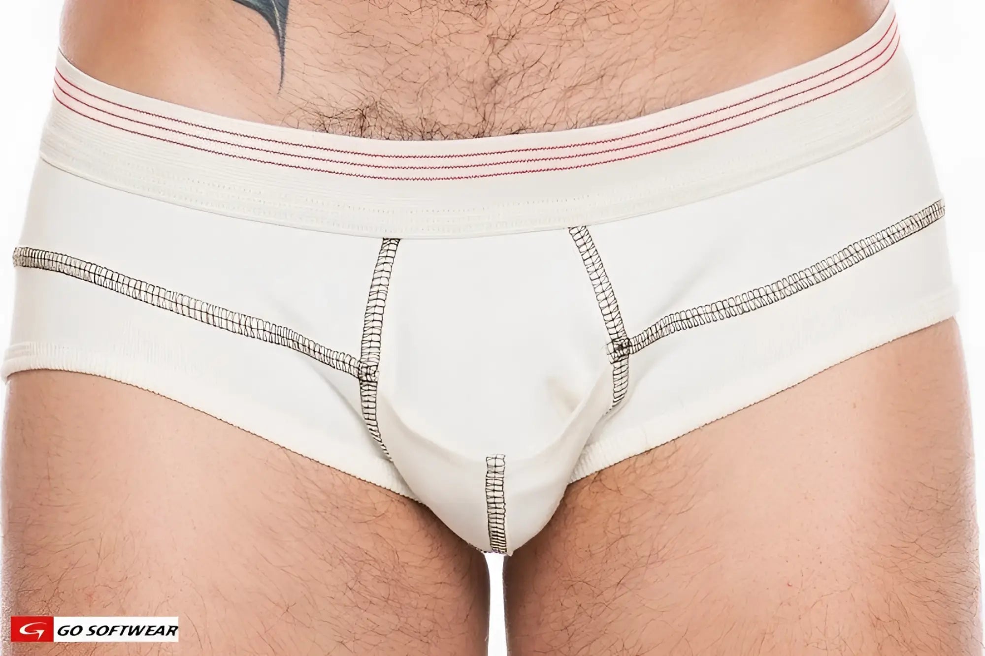 Cream-colored hemp brief with white elastic waistband featuring red stripes and black grid-patterned stitching