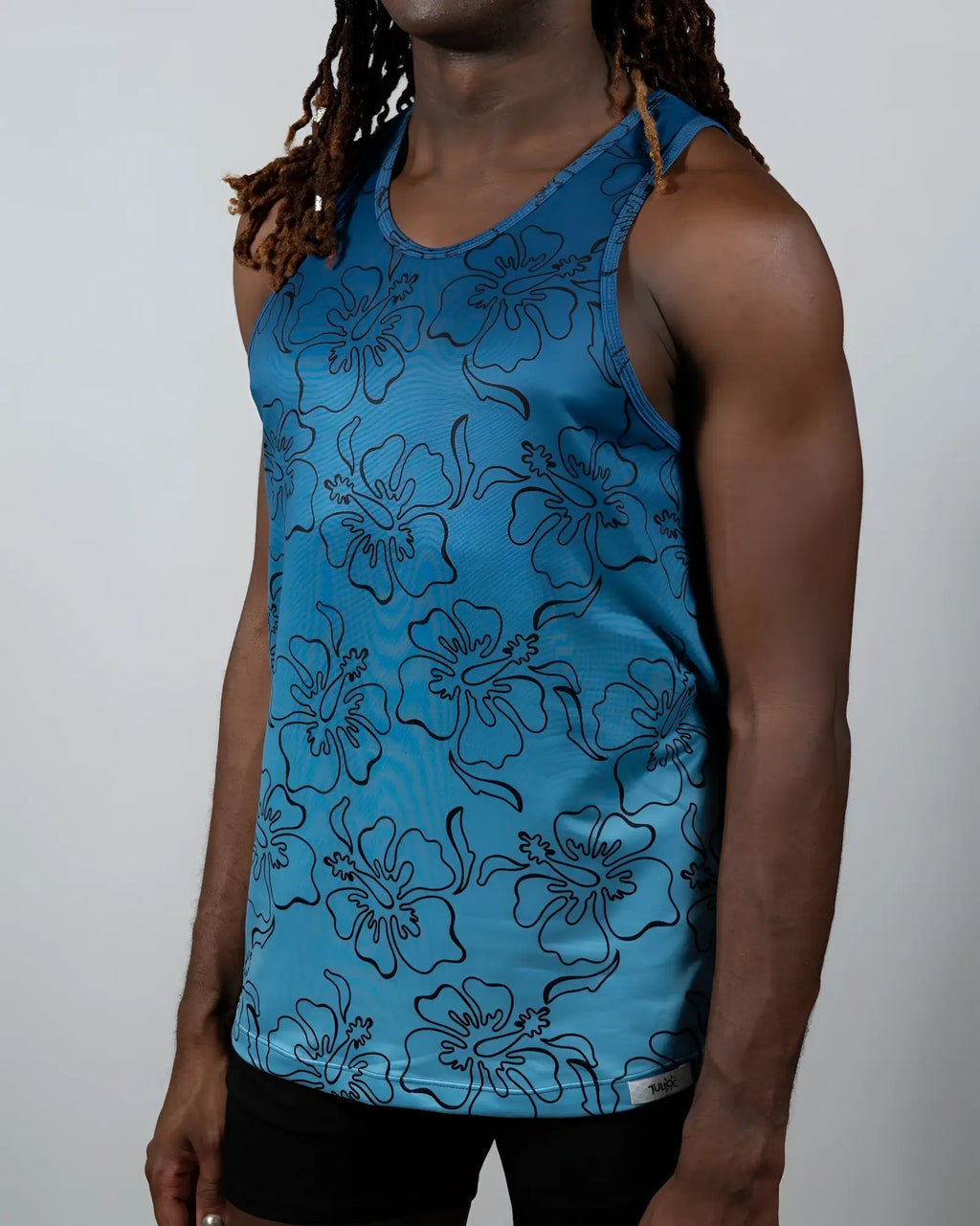 Blue floral-patterned hibiscus ombre print tank top with black outlines for casual summer wear