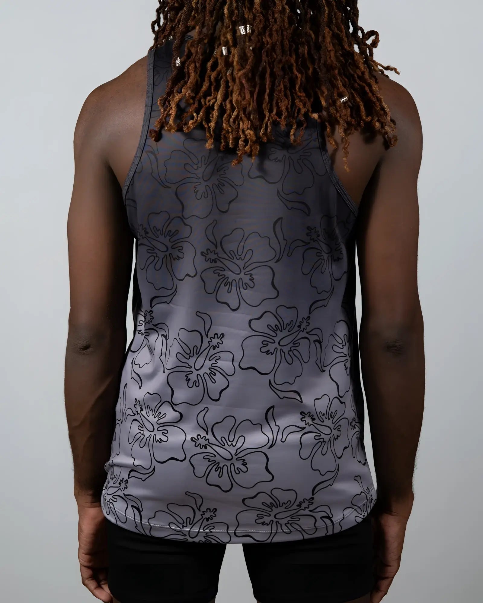 Gray tank top with black outlined hibiscus flower pattern from the hibiscus ombre print tank collection