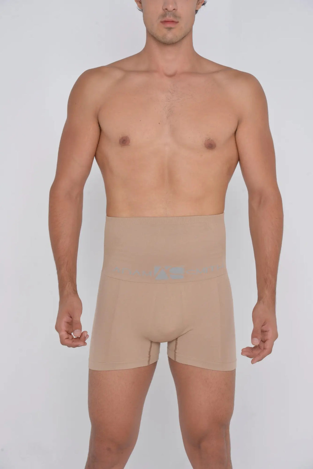 Beige high waist shaper trunks men’s compression shorts with light blue logo on front for support and shaping