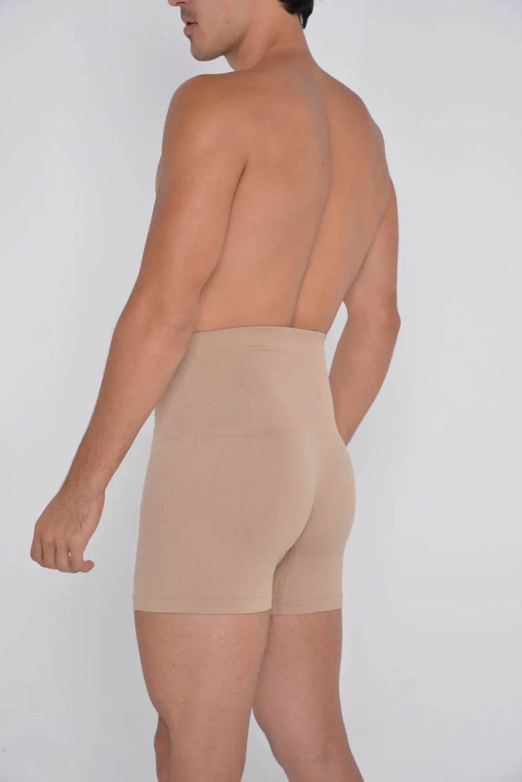 Beige high waist shaper trunks made of seamless fabric designed for comfortable tummy control and support