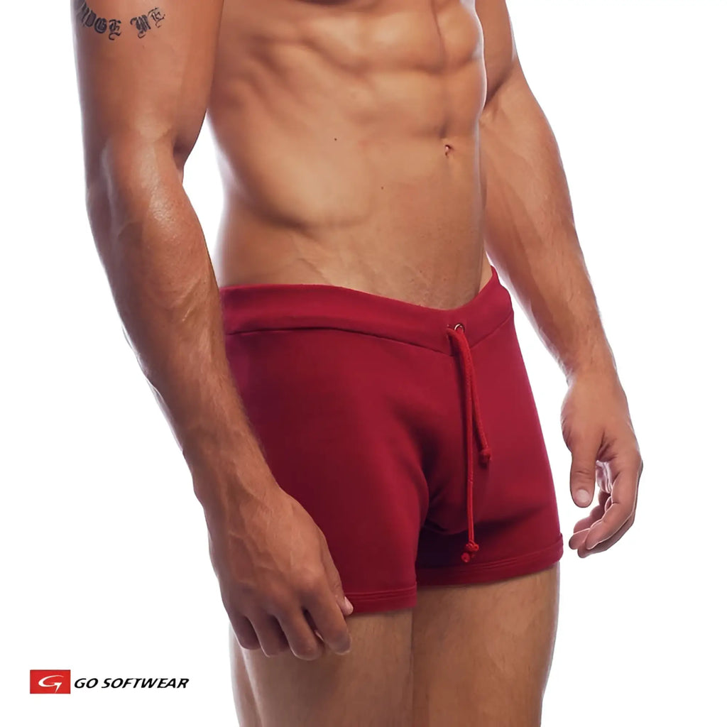 Red hiker shorts with a drawstring waistband made from soft fabric for athletic and outdoor use