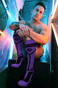 Purple and black knee-high hook up socks with bold geometric design and redwell brand printed across the calf