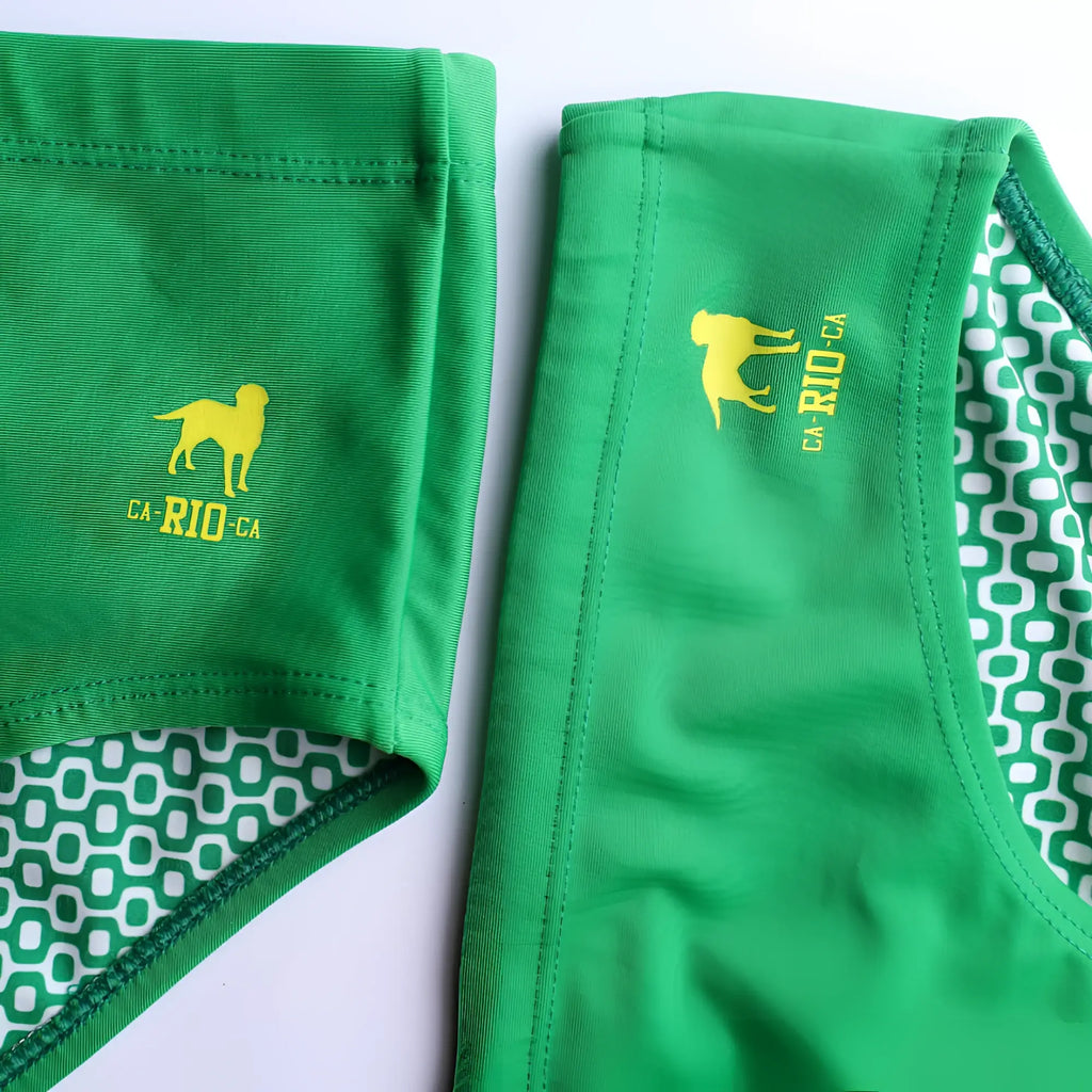 Hortelã green solid men’s swimming sunga with yellow dog ca-rio-ca logo waistband and white geometric lining