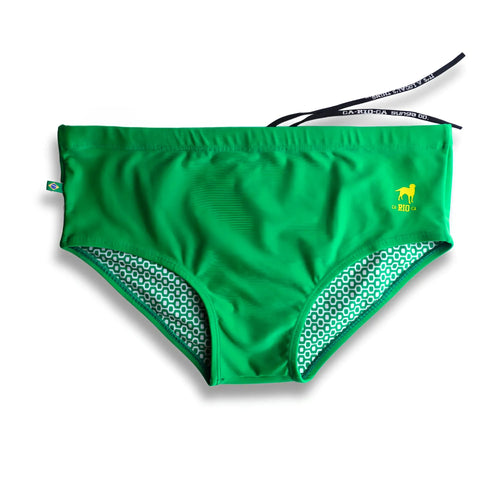 Hortelã green solid men’s swimming sunga with bright green swim trunks, subtle geometric inner lining, and yellow dog logo