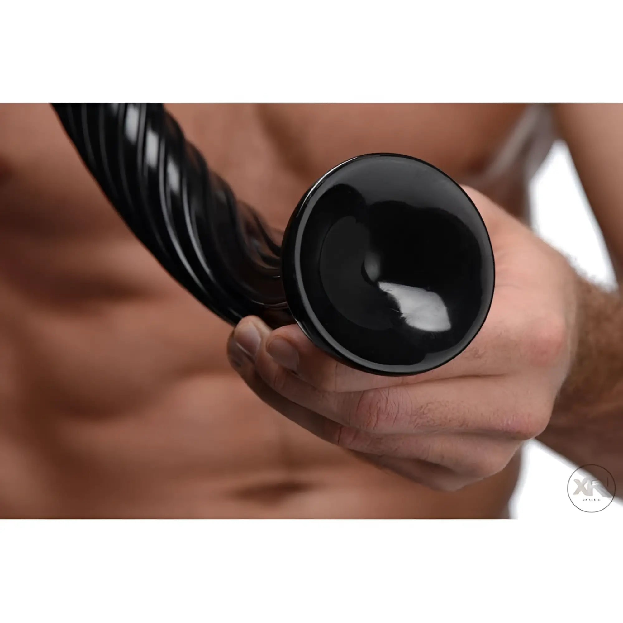 Hand holding a black, 19-inch Hosed Anal Snake with a spiraled, textured shaft and flared base.