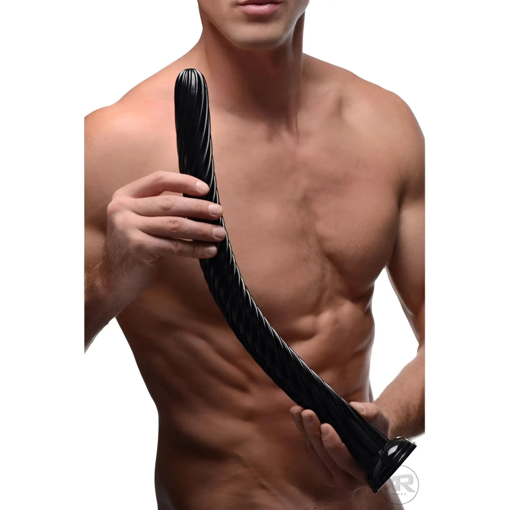 A shirtless man holding a long, black, ribbed Hosed 19-inch anal snake toy against a white background.