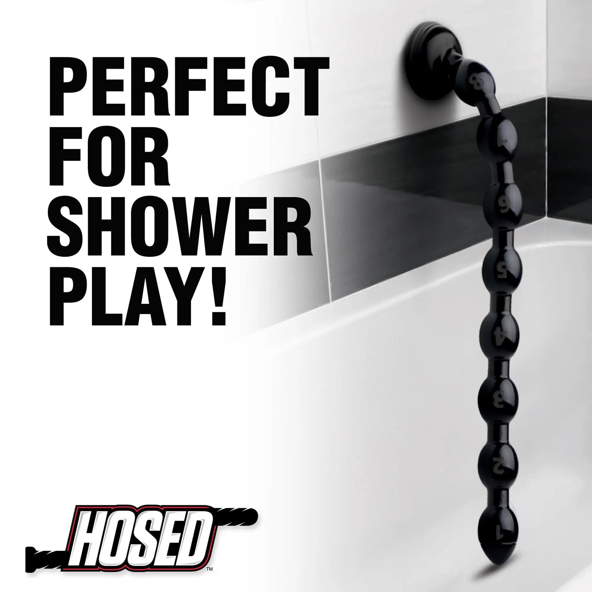 Hosed 19-inch black beaded anal snake suctioned to a white bathroom wall. Text reads: "Perfect for shower play!"