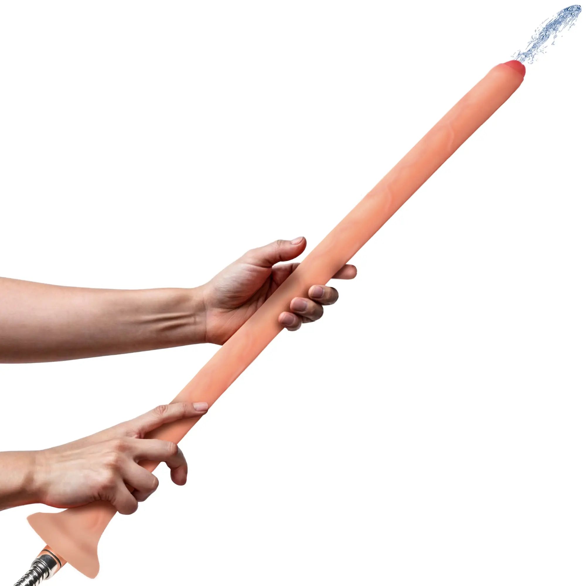 Hands holding a long, peach-colored, uncircumcised slim silicone Hosed enema nozzle spraying a stream of water.