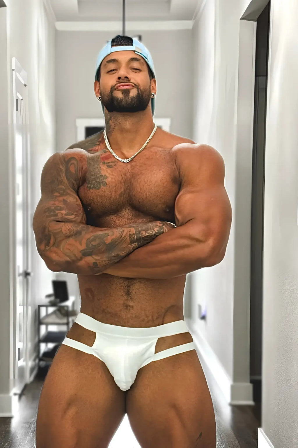 White athletic briefs with adjustable cut-out design in breathable fabric for host or travel use