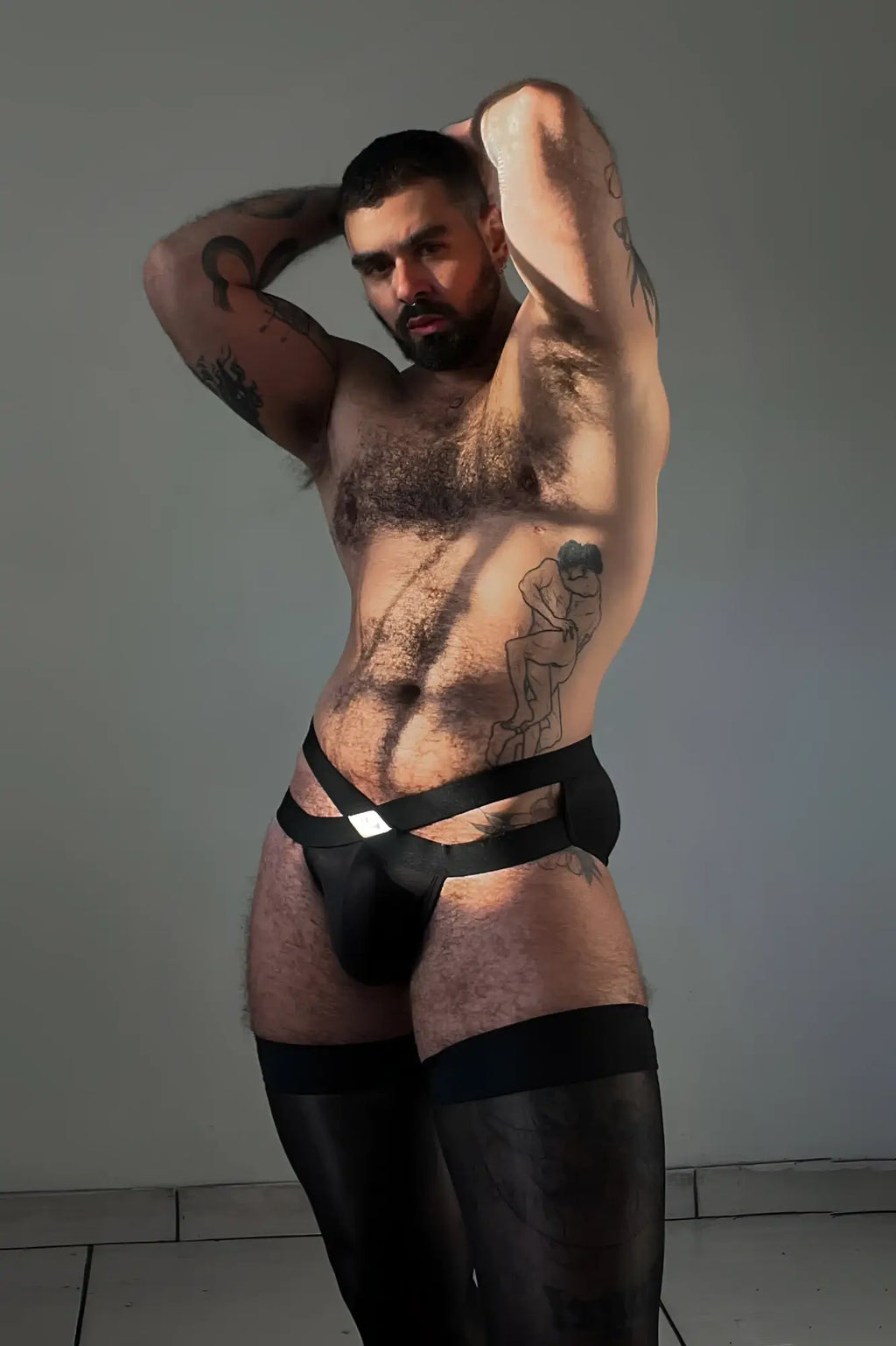 Black leather thong with silver buckle detail front view from hustler cross briefs obsidian black collection