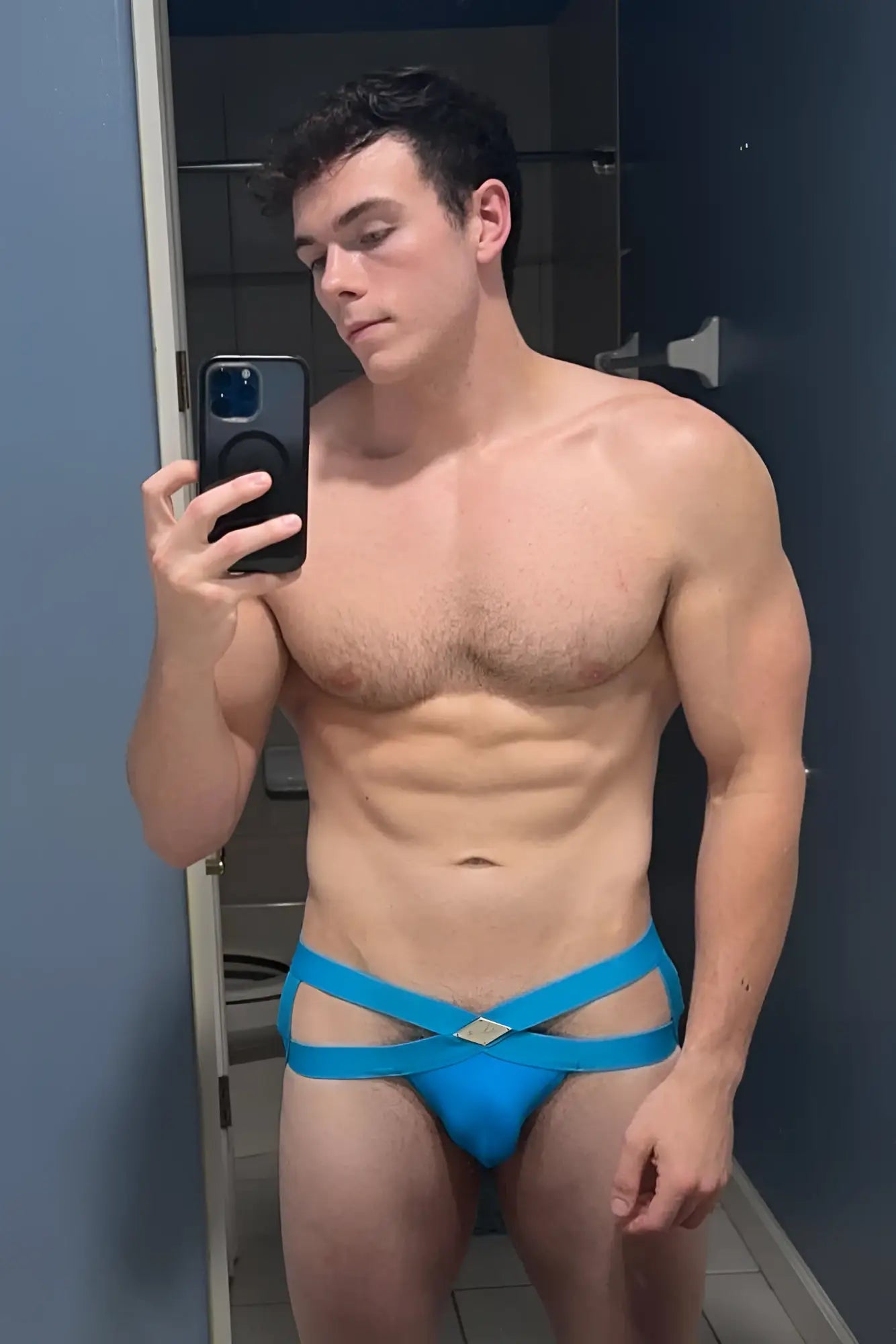 Hustler cross jockstrap sky blue made of bright blue strappy material with a diamond-shaped metallic accent center
