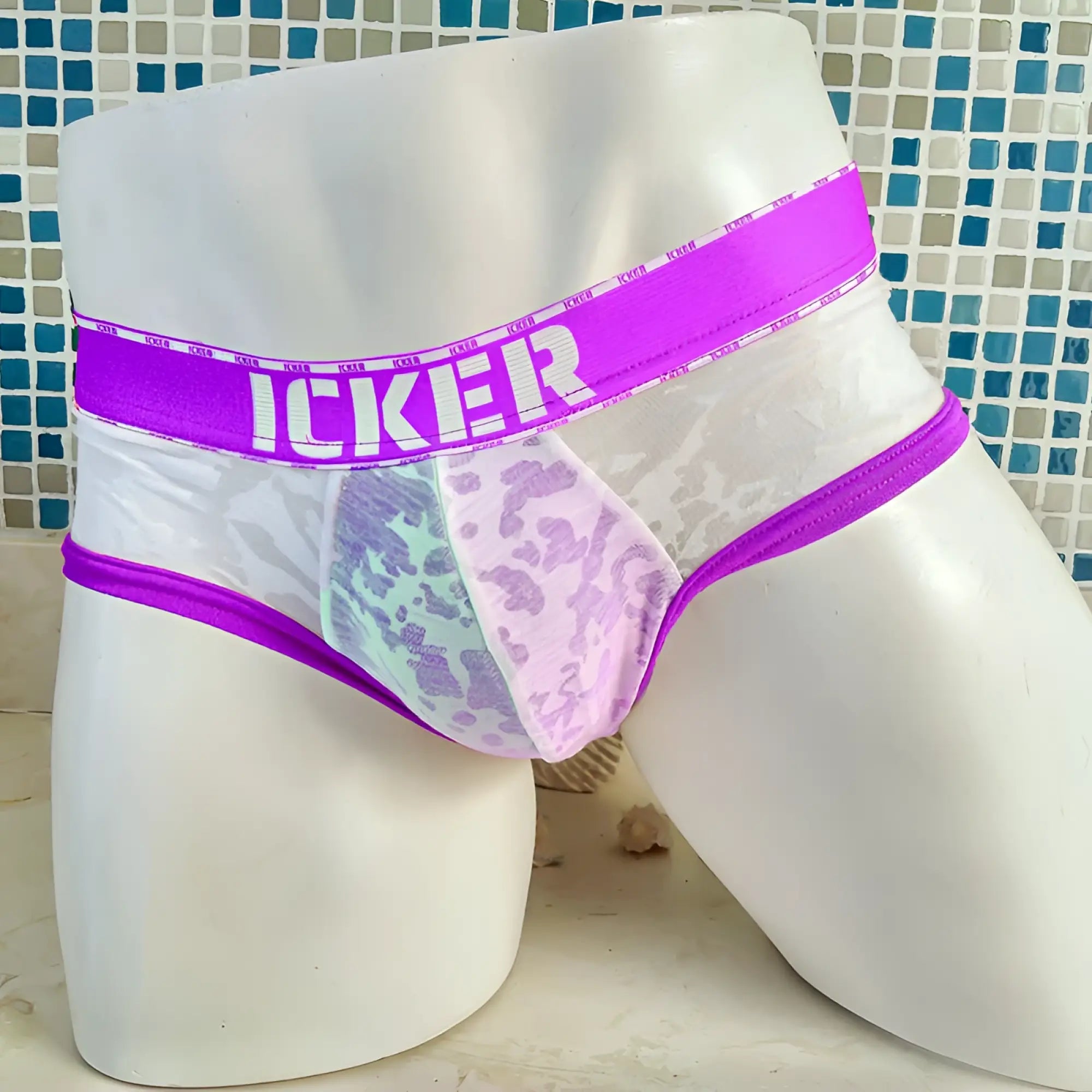 Purple and white lace-trimmed men’s mesh brief underwear with bold icker logo on waistband from icker sea acid line