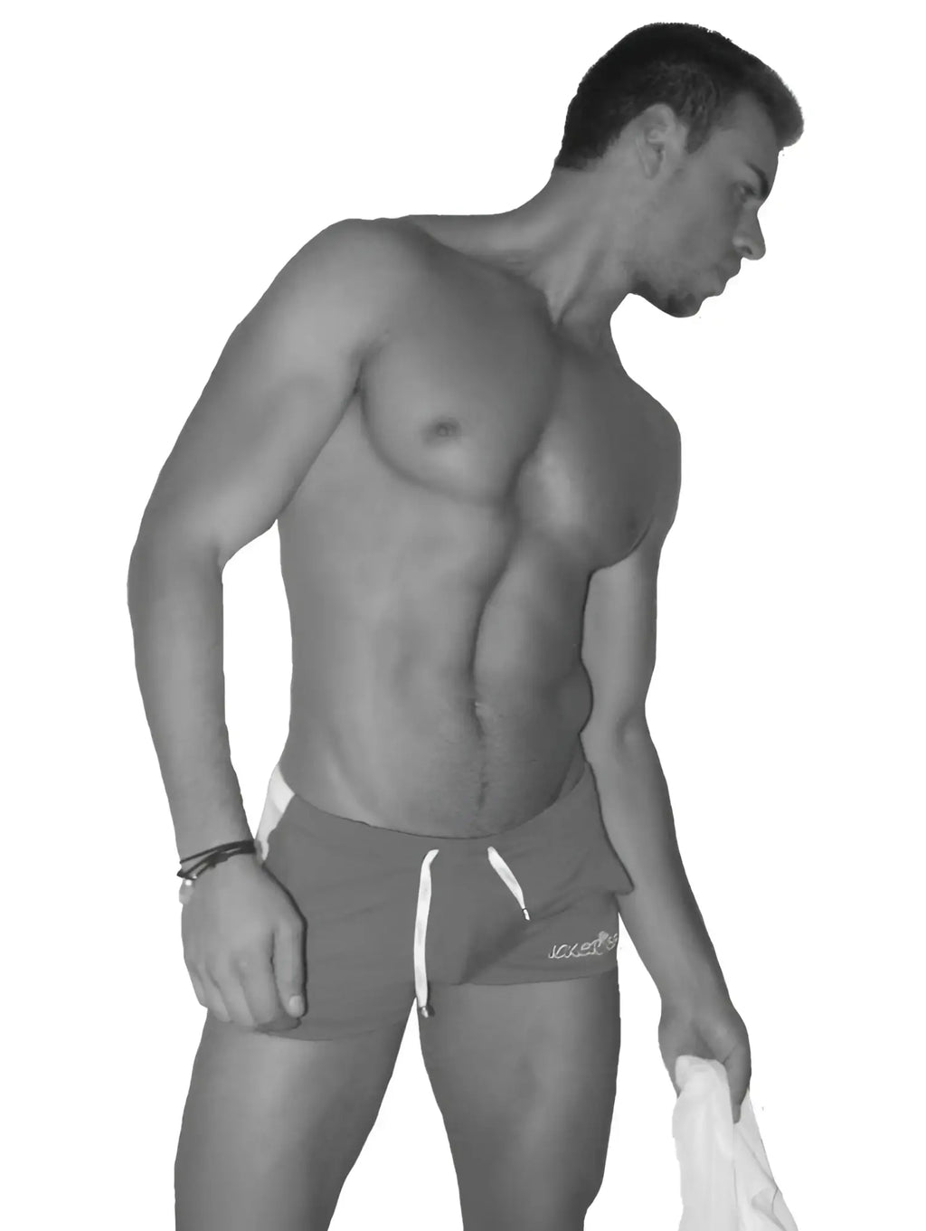 A man wearing icker sea air fitness side stripe dark athletic shorts with white drawstrings and logo on the right leg