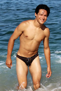 Black icker sea bikini swim trunks with white contrast stitching and drawstring closure for beachwear