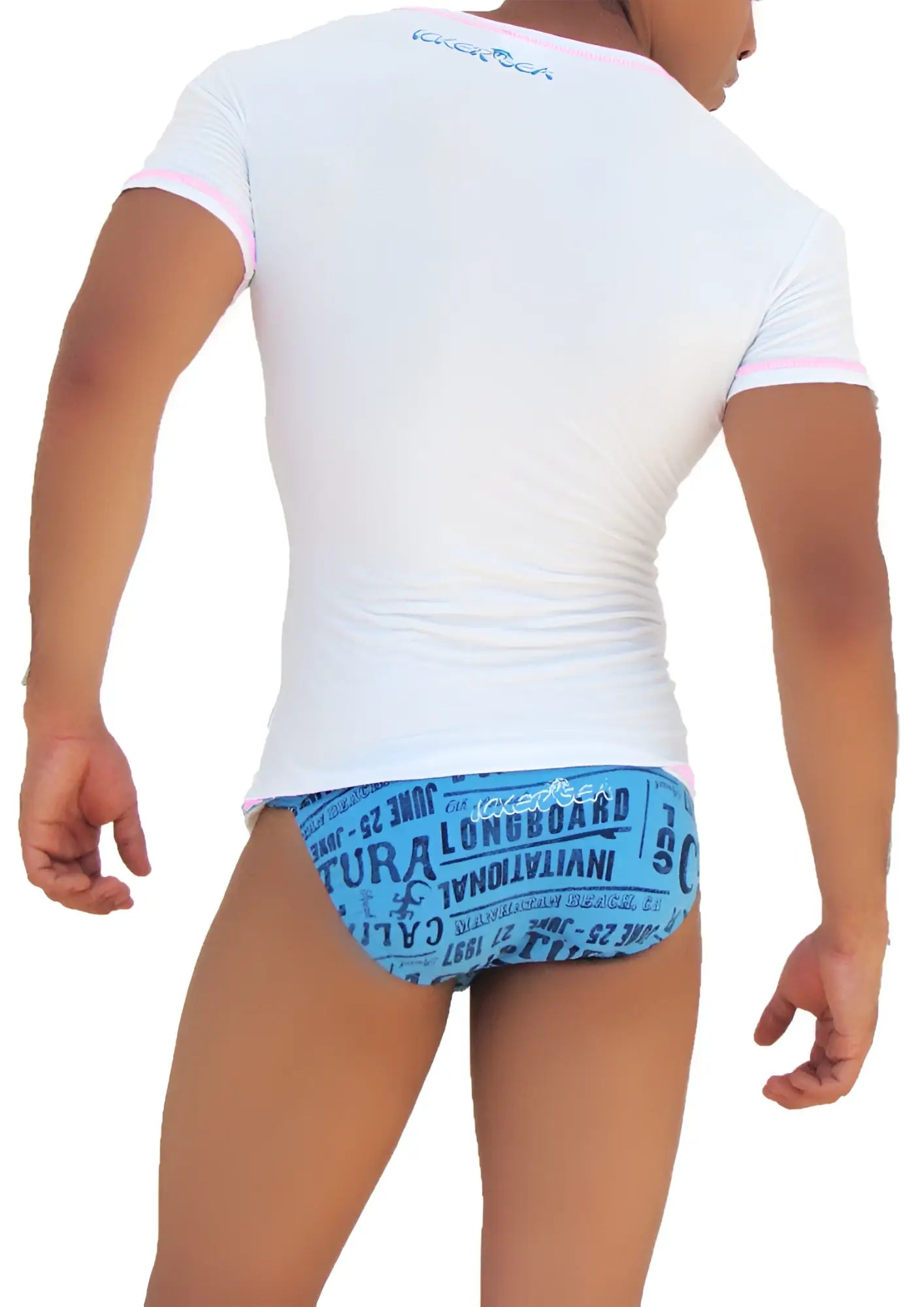 Back of icker sea white short sleeved rash guard with pink trim and blue graphic print for sun protection