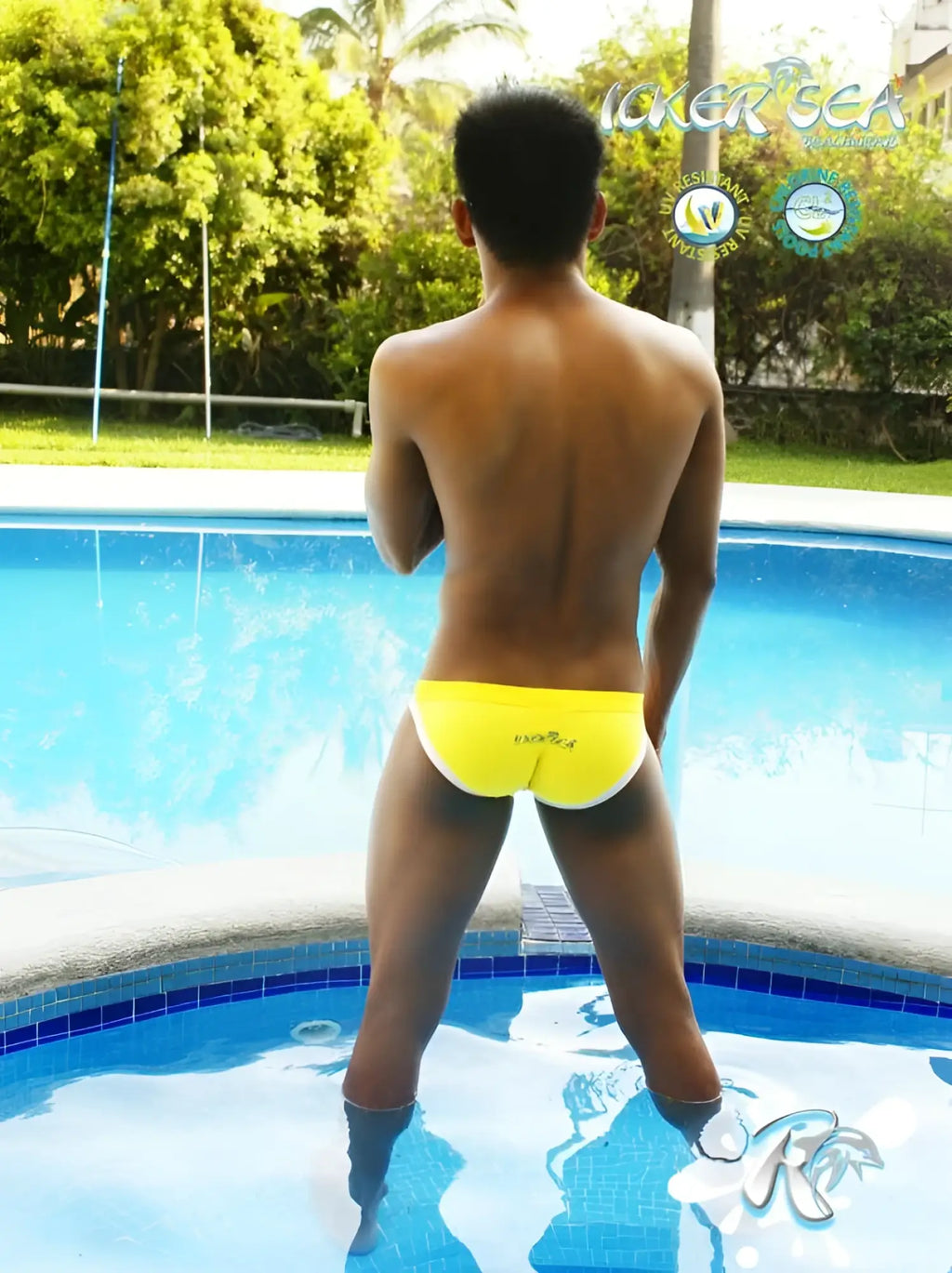 Back view of bright yellow mango microfiber bikini swim trunks with white trim and kicker sea branding