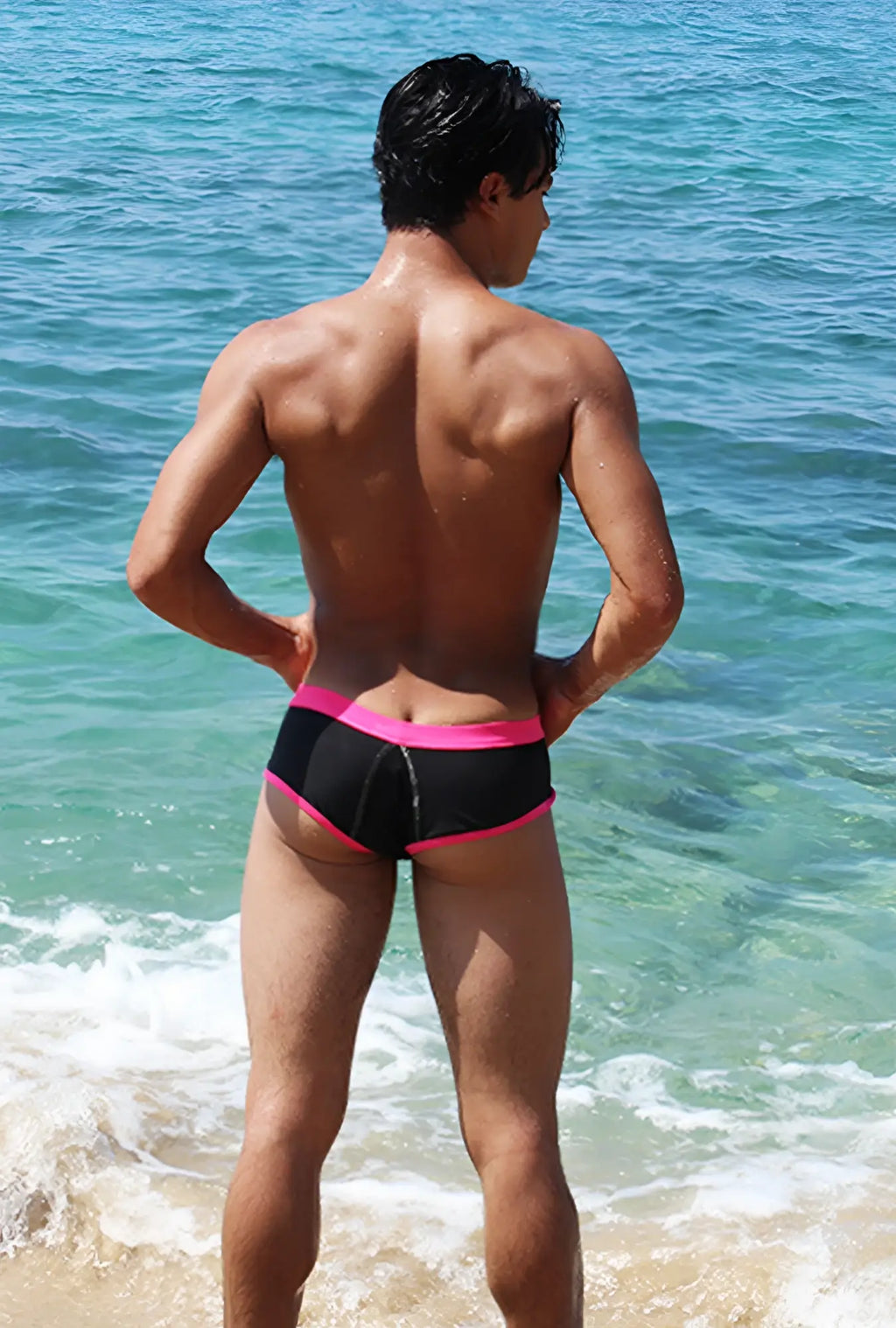 Black swim trunks with bright fuchsia contrast trim and stitching from icker sea cheeky bikini swimwear collection