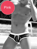 Pink swim trunks with white waistband and drawstring featuring vixen logo from icker sea cheeky mini bikini collection